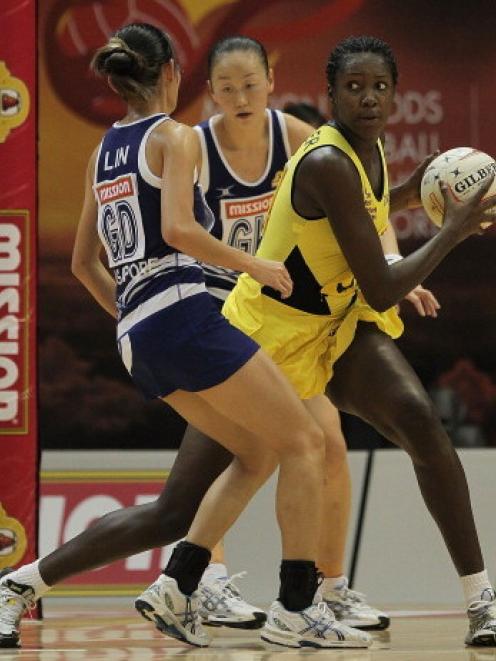 Jhaniele Fowler (in yellow) in action for Jamaica against Singapore last year. Photo Getty
