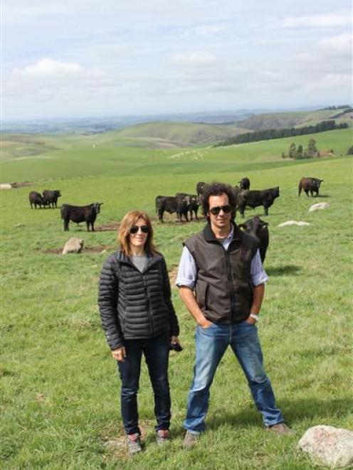 Jimena Popelka and Francisco Arrosa view cattle at Neil and Rose Sanderson's Fossil Creek stud in...