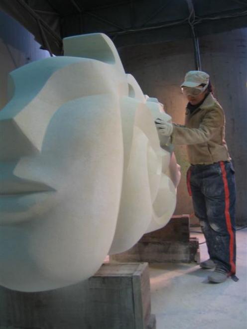 Jin Lee works on an Oamaru stone sculpture in her Korean studio.