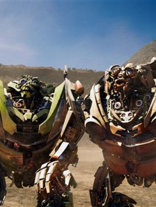 Jive-talking twin robots, Skids, left, and Mudflap are shown in a scene from, "Transformers:...