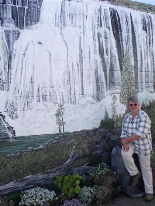 Jo Blakey admires a mural painted by her friend Joy Gibson. Photo by Sally Rae.