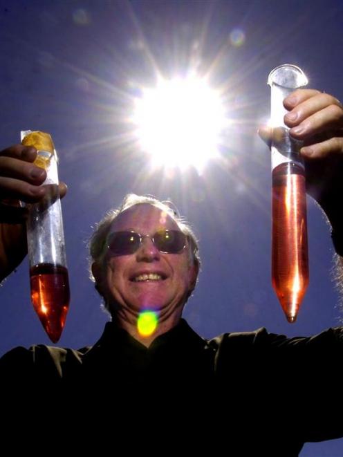 John Bradley collects rainfall measurements. Photo by Craig Baxter.