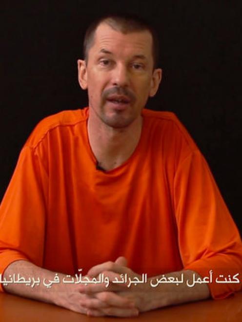 John Cantlie, pictured in a video posted on the internet.