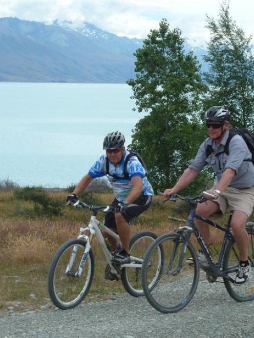 John Dunn (left) and Alps 2 Ocean chairman Mike Neilson ride the Pukaki section of the Alps 2...