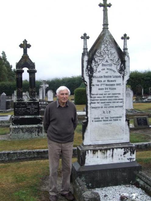 John Foley beside the grave of union organiser William Hobson Lundon, who died in 1907 and is...