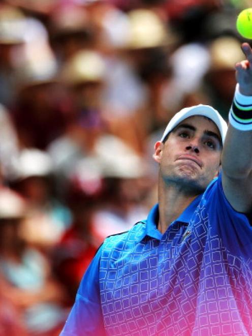 John Isner used his powerful serve to win the final.  (Photo by Anthony Au-Yeung/Getty Images)