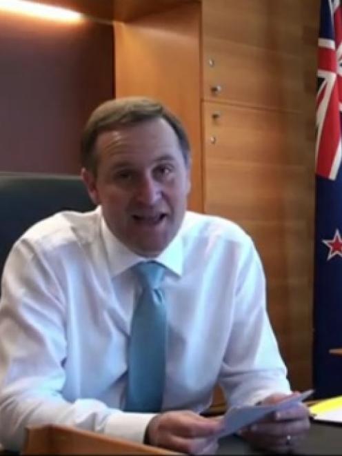 John Key invites David Letterman to New Zealand in this screen grab from a YouTube video.
