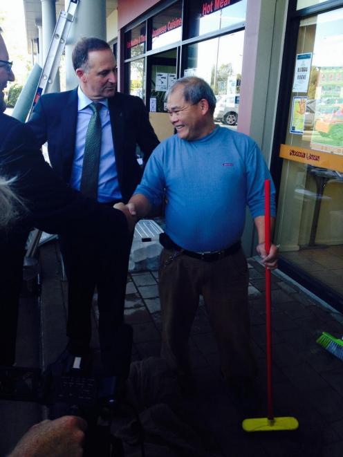 John Key met flood-hit business owners in Christchurch this morning. Photo from @johnkeypm