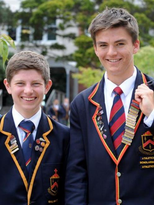 John McGlashan College pupils Andrew Logie (left) and Ed Davies smile after receiving  McGlashan...
