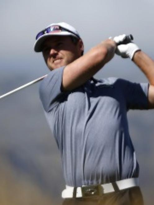 Joint leader Matthew Griffin, of Australia, hits a fairway iron during round two of the New...