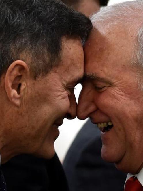 Judges John Macdonald (left) and Jim Large  hongi during a mihi whakatau (welcome speech) before...