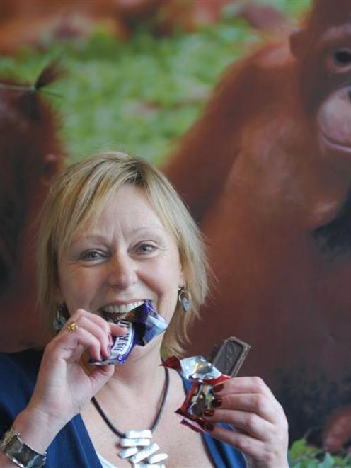 Judith Curran, of Dunedin, celebrates victory in the campaign to rid Cadbury dairy milk chocolate...