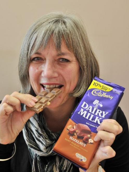 Judith Mair, Cadbury Dunedin site manager, samples the new style Dairy Milk chocolate. Photo by...