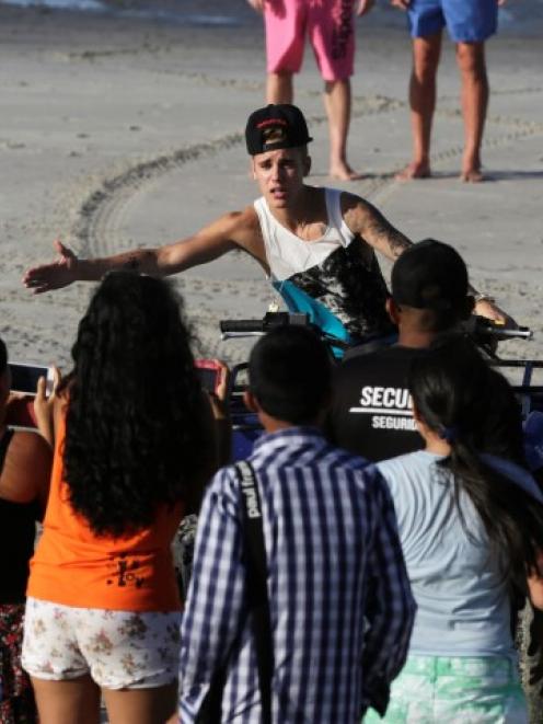 Justin Bieber greets his fans in a resort in Punta Chame, on the outskirts of Panama City,...