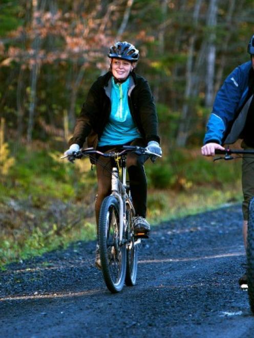 Kaci Hickox (L) and boyfriend Ted Wilbur go for a bike ride in Fort Kent, Maine. REUTERS/Ashley L...