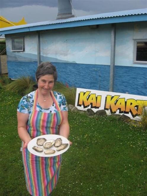 Kai Kart co-owner Hilli Maass-Barrett, of Stewart Island, with some Southern Glory oysters, which...