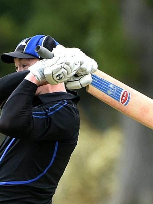 Kaikorai's Geordie Scott hammers  a boundary during his side's senior match against North East...