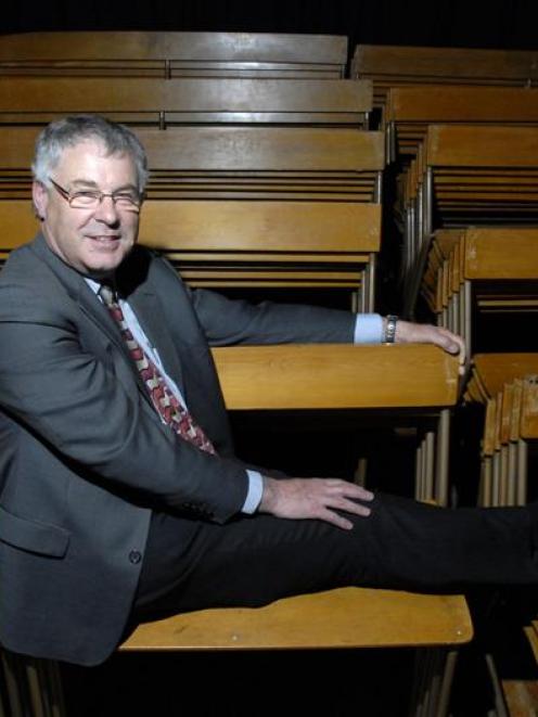 Kaikorai Valley College principal Philip Craigie sits among the 150 school hall pews which will...