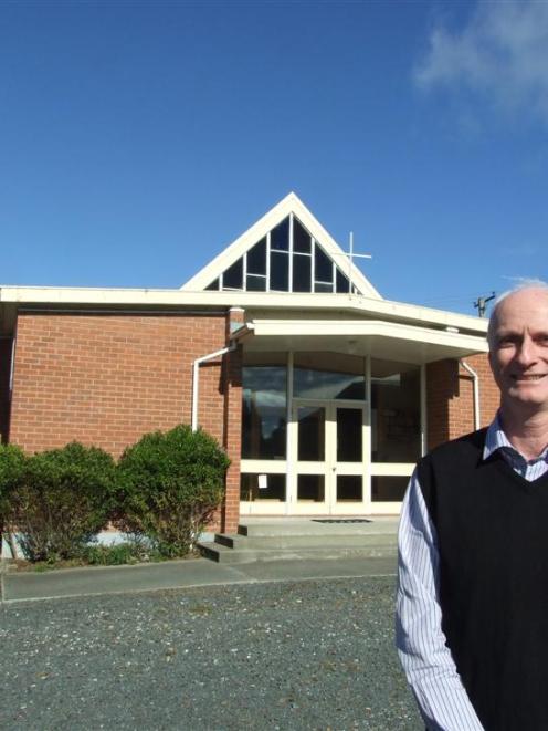 Kaitangata-Stirling-Lovells Flat Presbyterian Church pastor Alex McLaughlin outside its church in...