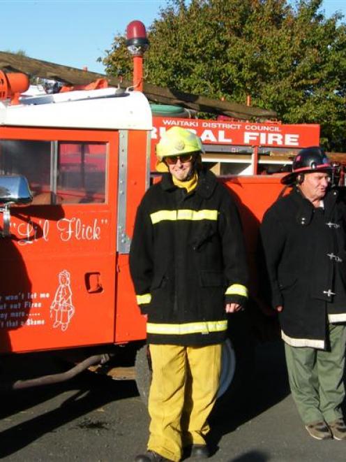 Kakanui volunteer firefighters (from left), Terri Smith and James Slater wear modern gear...