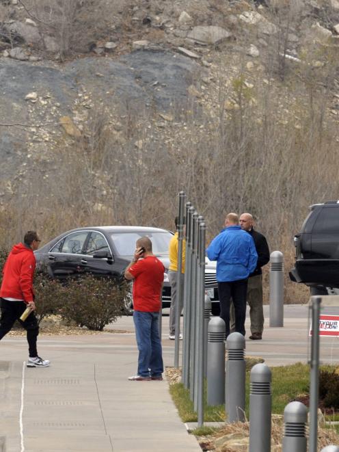 Kansas City Chiefs staff stand outside the team's practice facility following an apparent murder...