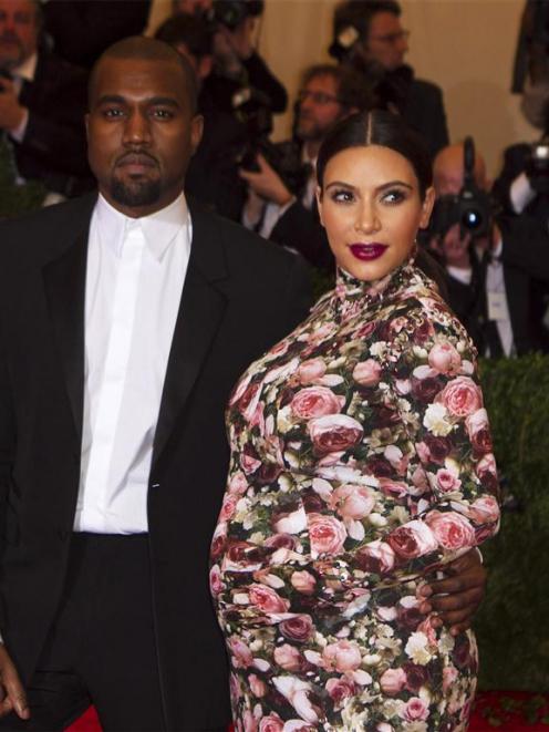 Kanye West and Kim Kardashian are shown in this May file photo. REUTERS/Lucas Jackson/Files