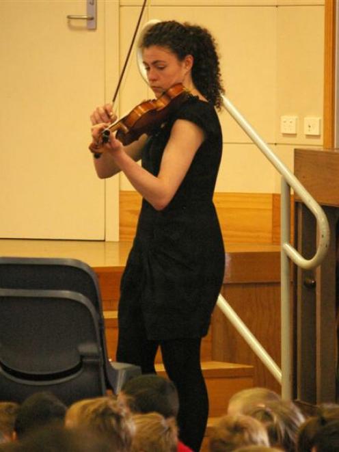 Karla Norton demonstrates the short, percussive notes of pizzicato on Wednesday. Photos by Hamish...