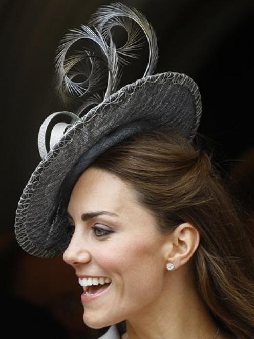 Kate, Duchess of Cambridge watches the procession pass at the Order of The Garter Service in...