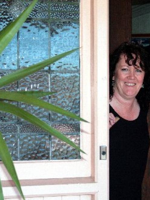 Kathy Scott enjoys the warmth of her new home after getting the cost of installing insulation and...