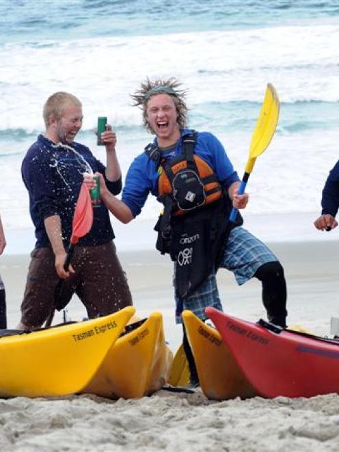 Kayakers Anthony Harris, Luke Hardinge, Harrison Greer and Jethro Hardinge celebrate on St Kilda...
