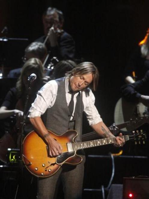 Keith Urban performs in a tribute to Glen Campbell at the 45th Country Music Association Awards...