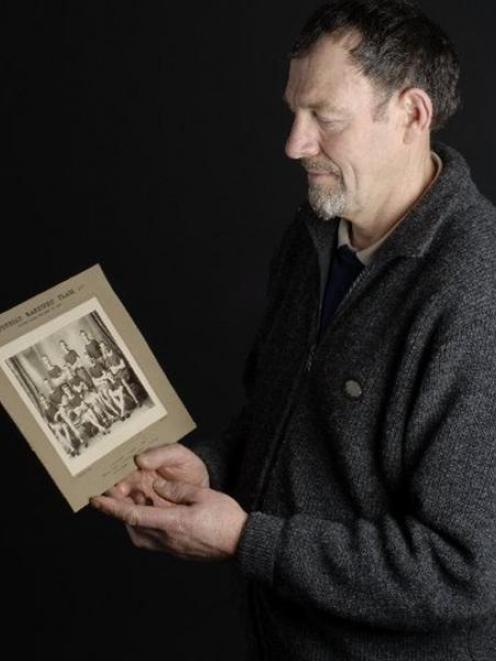 Dunedin runner Keith Johnstone holds the photo of the Dunedin team that won the Edmond Cup in...