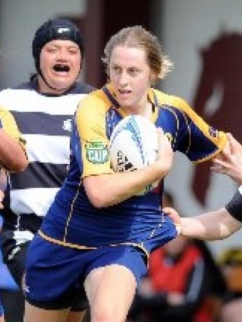 Kelly Brazier with ball in hand against Hawkes Bay at the North Ground on Saturday. Also pictured...