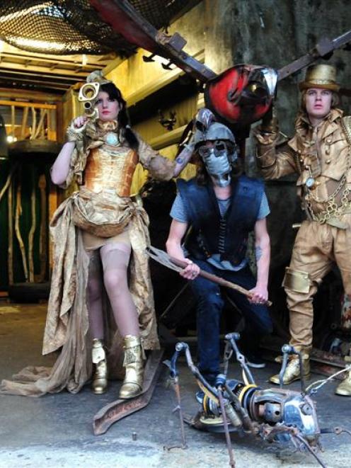 Kelsi Herrick, Matt Lyng and Josh Bennison model "steampunk" outfits designed by Chris Meder and...