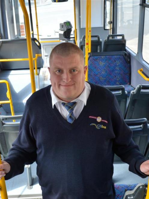 Kelvin McHardy inside the Passenger Transport city bus he will drive during the National Summer...