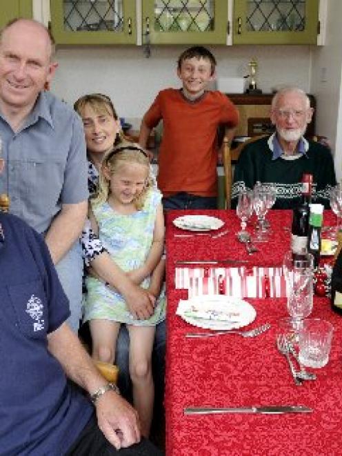 Ken Hall (left) celebrates Christmas yesterday with (from left) Royal New Zealand Air Force...