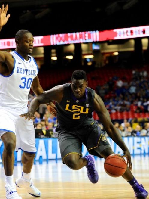 Kentucky Wildcats forward Julius Randle (L) can't stop LSU Tigers forward Johnny O'Bryant III in...