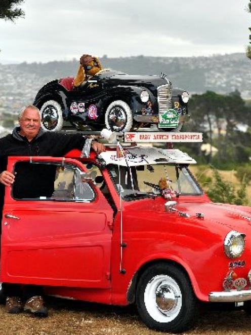 Kevin Heyward with his cute ute, a 1957 Austin A35 pick-up with Austin J40 pedal car on the roof....