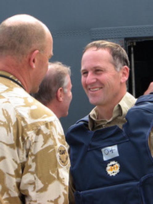 New Zealand Prime Minister John Key arrives to visit troops in Kabul