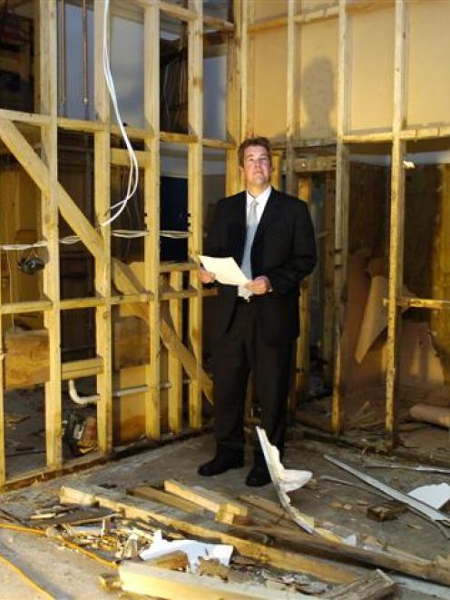 Kings High School principal Dan Reddiex stands in the school's gymnasium changing rooms which are...