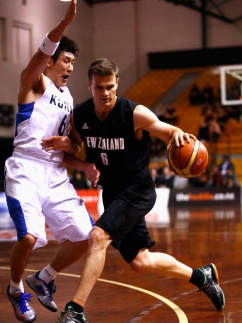Kirk Penney takes the ball forward for the Tall Blacks against South Korea. (Photo by Phil Walter...