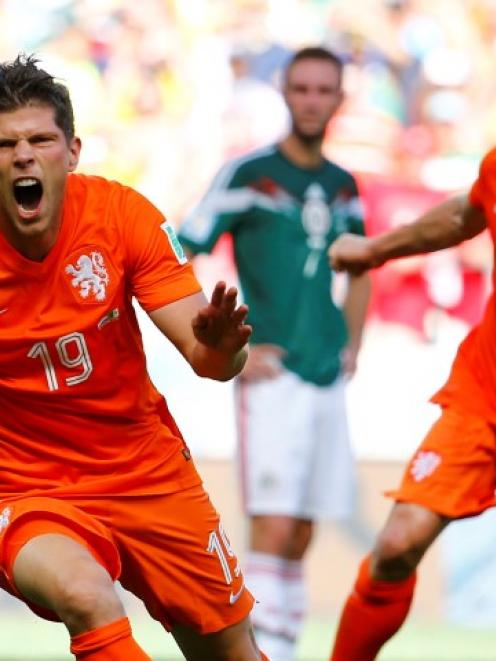 Klaas-Jan Huntelaar (L) and Dirk Kuyt of the Netherlands celebrate Huntelaar's goal against...