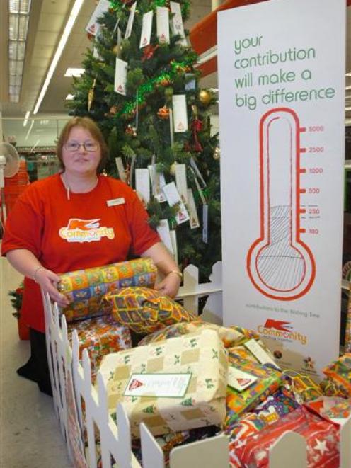 Kmart Wishing Tree Appeal organiser Dawn Barnes with some of the gifts people have donated to the...
