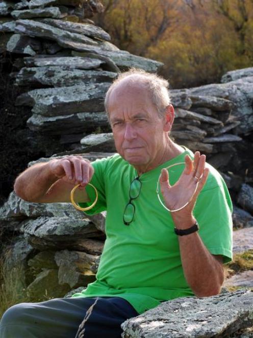 Middlemarch jeweller Kobi Bosshard displays a gold necklace and bangle made with the help of...