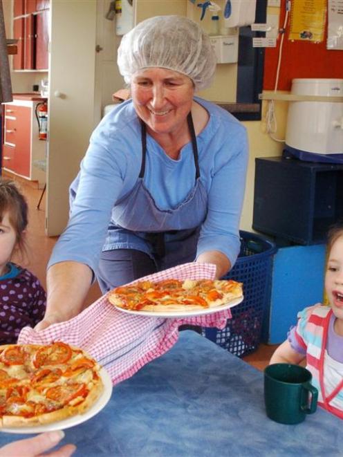 Koputai Early Childhood Centre's chef Leonie Thorneycroft serves lunch for children Lulu McLane ...