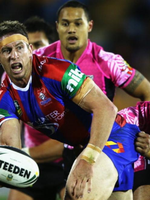 Kurt Gidley of the Knights looks to offload the ball during the NRL match between the Warriors...