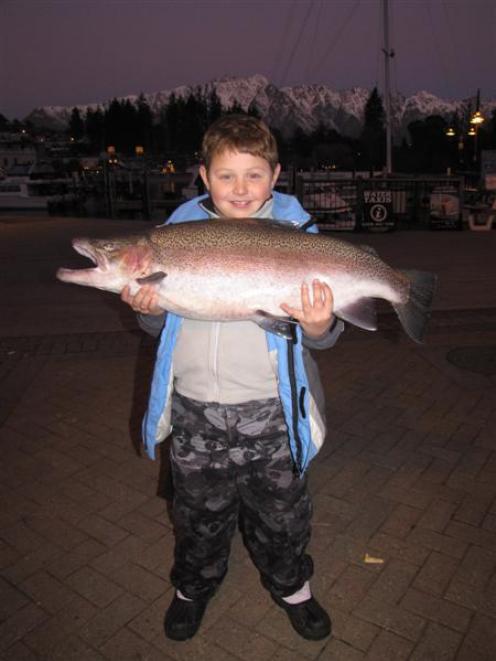 Lachlan Newham (8), from Sydney, with his 7.75kg rainbow trout caught in Lake Wakatipu. Photo by...