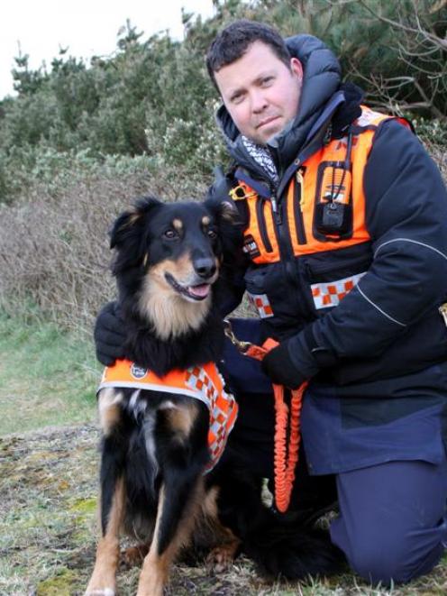 LandSAR operational dog handler Nicholas Sleeman, of Dunedin, with his a huntaway-collie cross...