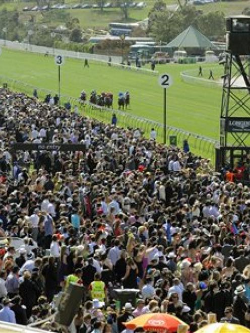 Large crowds wait for the big race on Melbourne Cup Day at Flemington Racecourse, in Melbourne,...
