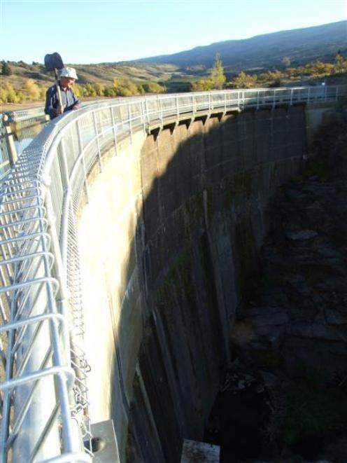 Last Chance Irrigation chairman Gavin Dann inspects damaged caused by vandals on Conroys dam,...
